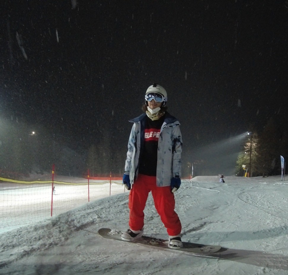 Mattia snowboarding at night